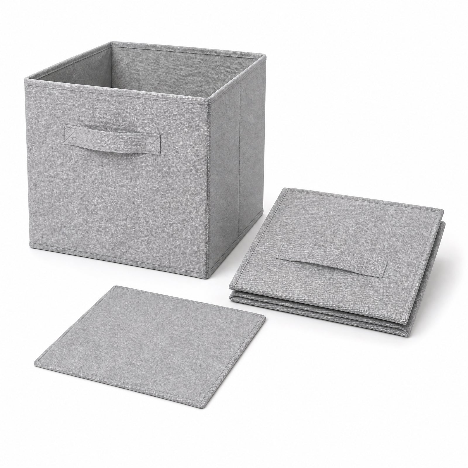 One assembled fabric cube beside one folded cube and its base insert